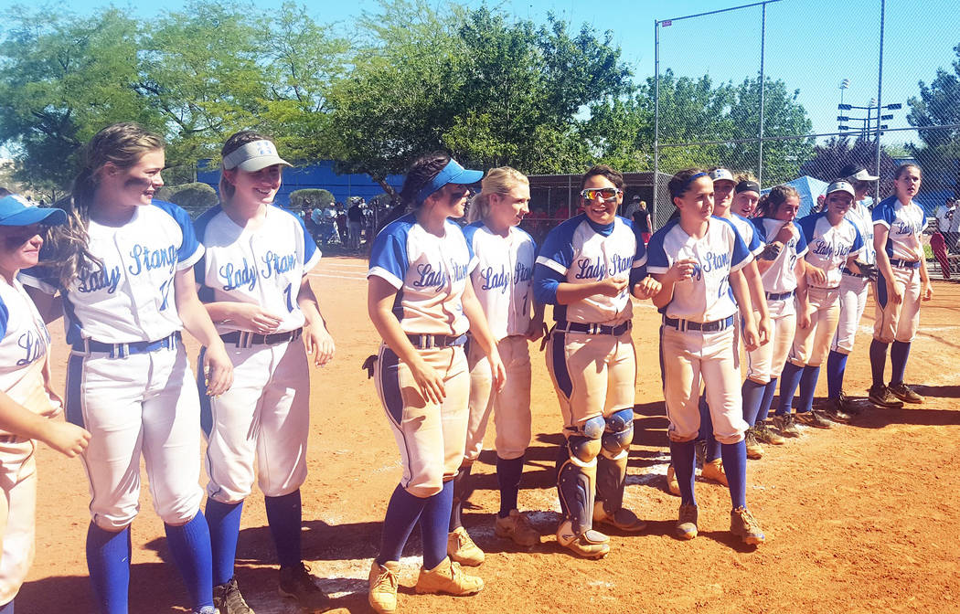 Needles softball players prepare to receive their state championship medals after defeating ...