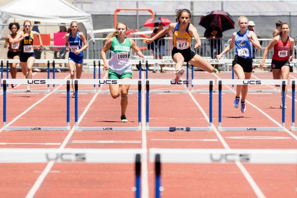 South Tahoe senior Maya Brosch clears a hurdle during the girls 300-meter hurdles during the ...