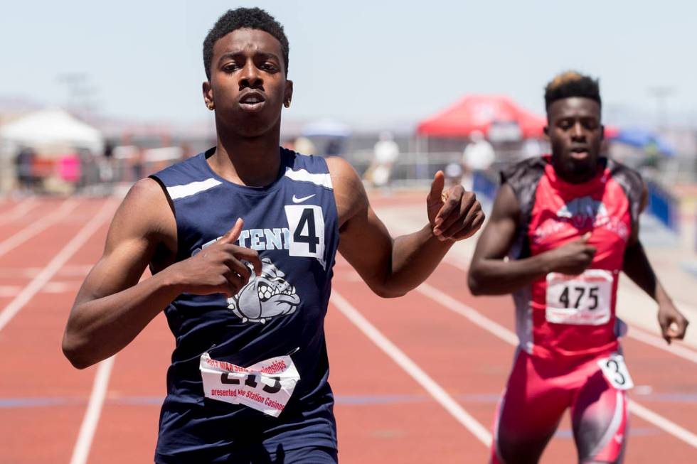 Centennial senior Savon Scarver finishes in first with a time of 21.51 in the boys 200-meter ...