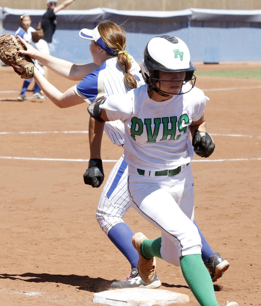 Palo Verde’s Camden Zahn, right, crosses first base safely as Reed’s Allie Hughe ...