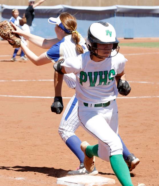 Palo Verde’s Camden Zahn, right, crosses first base safely as Reed’s Allie Hughe ...