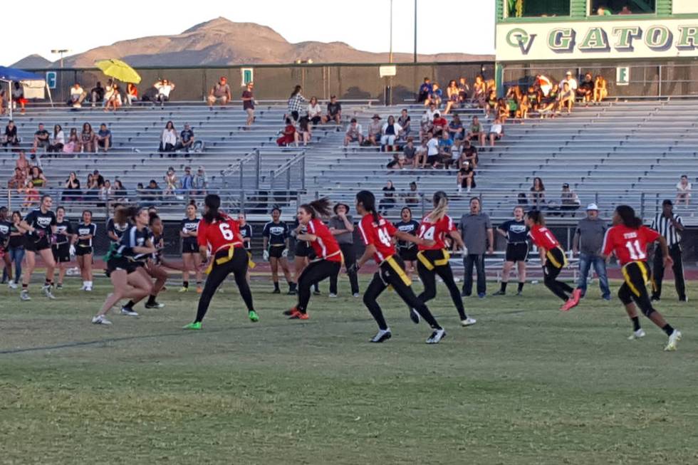 Centennial’s Denae Benites (24) takes the handoff from Cimarron-Memorial’s Tiarr ...