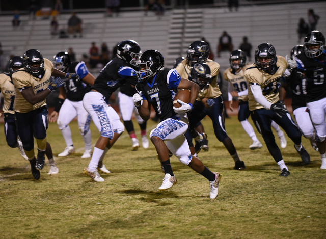 Desert Pines Isaiah Morris (7) runs down field against the Cheyenne defense during their foo ...