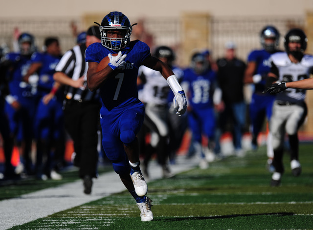 Desert Pines running back Isaiah Morris rushes for a first down against Spring Creek in the ...