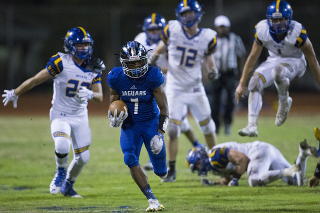 Desert Pines running back Isaiah Morris (7) runs the ball against Moapa Valley in their stat ...