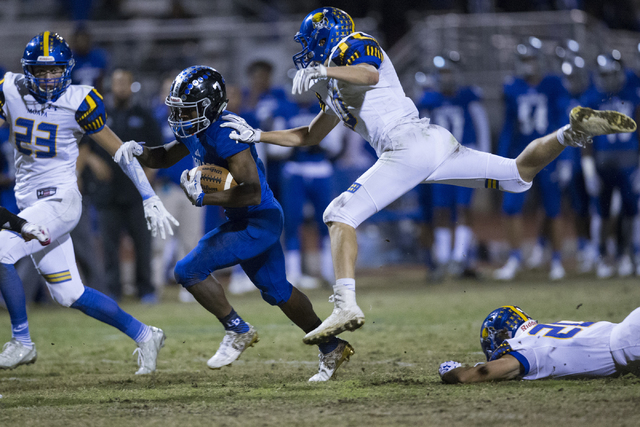 Desert Pines running back Isaiah Morris (7) runs the ball against Moapa Valley in their stat ...