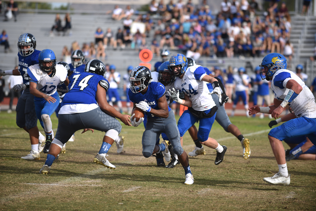 Desert Pines Isaiah Morris (7) runs the ball against South Tahoe during their 3A state semif ...