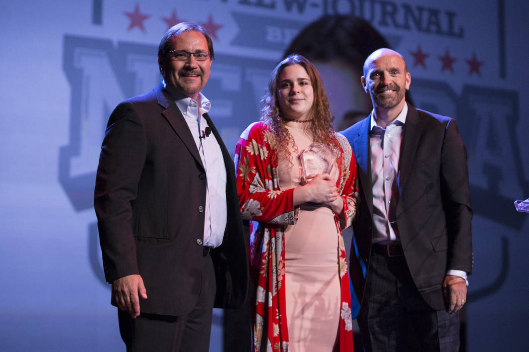 Joelle Beachler, center, is presented with the No Limits Award, by Bill Bradley, left, sport ...