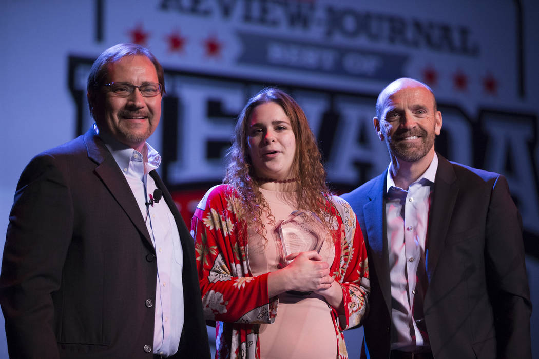 Joelle Beachler, center, is presented with the No Limits Award, by Bill Bradley, left, sport ...