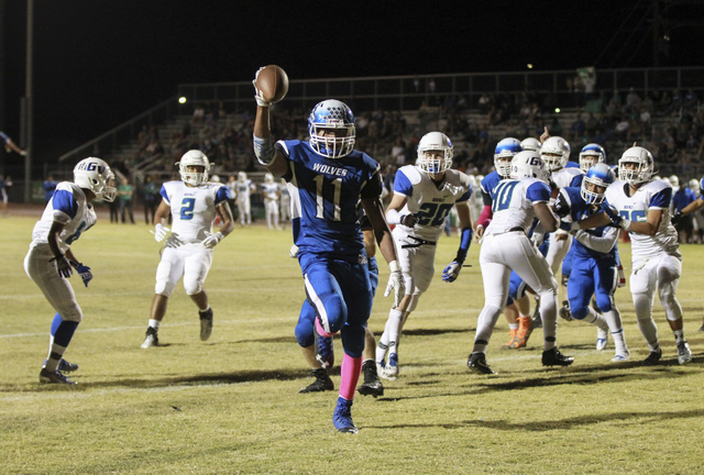 Basic’s Frank Harris (11) scores a touchdown against Green Valley during a football ga ...