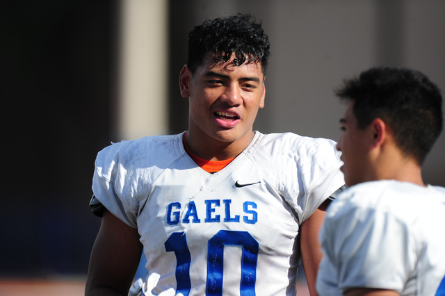 Bishop Gorman linebacker Palaie Gaoteote (10) talks to a teammate during practice at Bishop ...