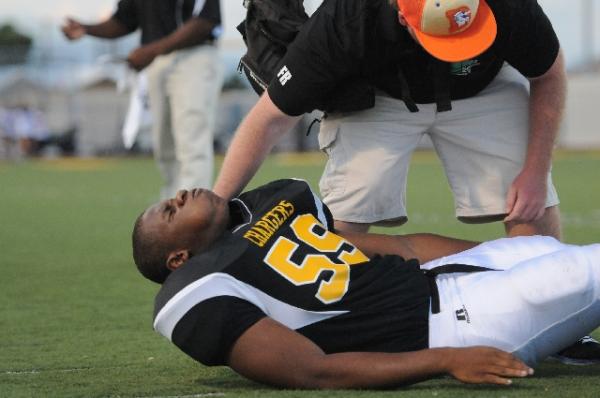 An athletic trainer tends to injured lineman K Rell Craft during Clark’s 39-0 win ...