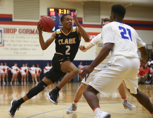 Clark guard Sedrick Hammond (2) drives to the basket past Bishop Gorman guard Christian Popo ...