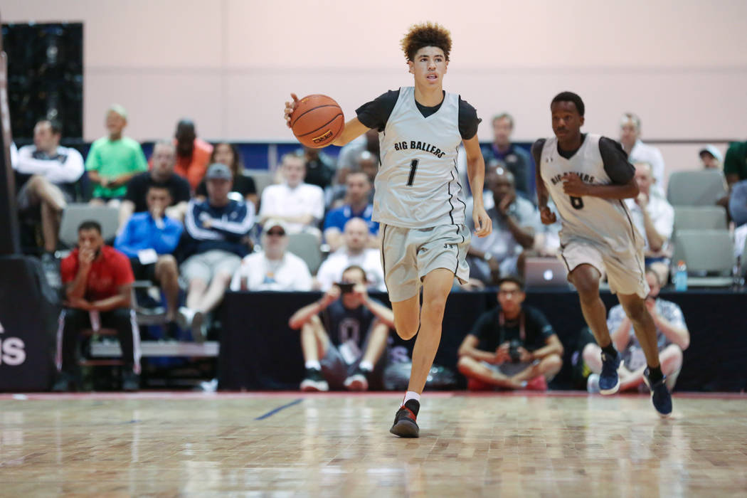 Big Baller Brand player LaMelo Ball handles the ball during an Adidas Summer Championship AA ...