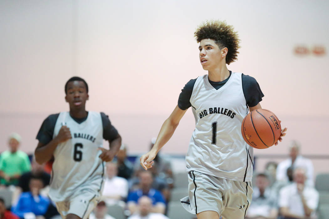 Big Baller Brand player LaMelo Ball handles the ball during an Adidas Summer Championship AA ...