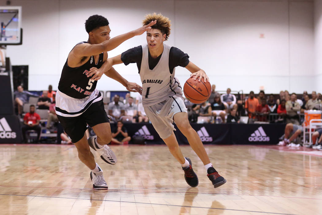 Big Baller Brand player LaMelo Ball tries to drive past a Play Hard Play Smart player during ...