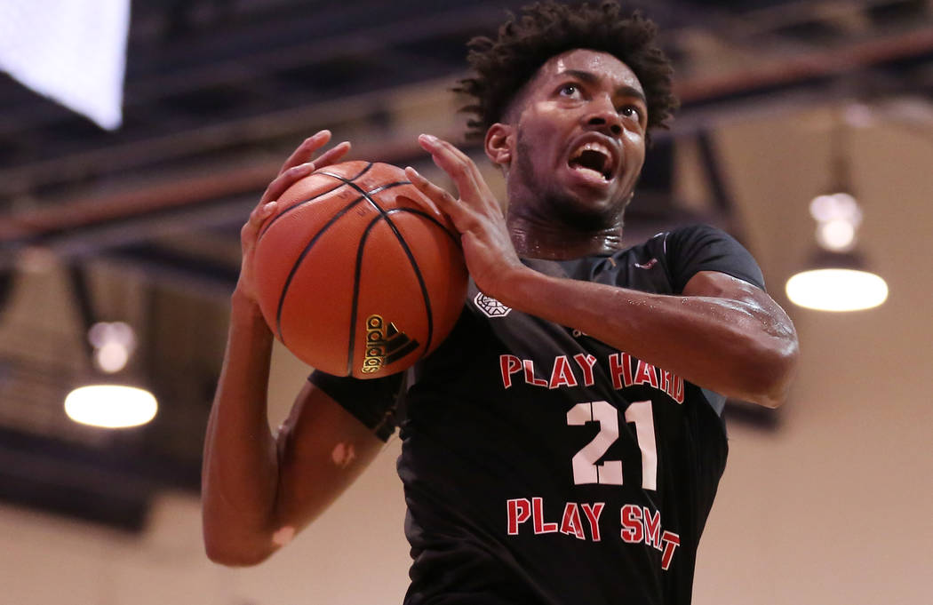 Play Hard Play Smart player Jordan Brown goes up for a basket during an Adidas Summer Champi ...