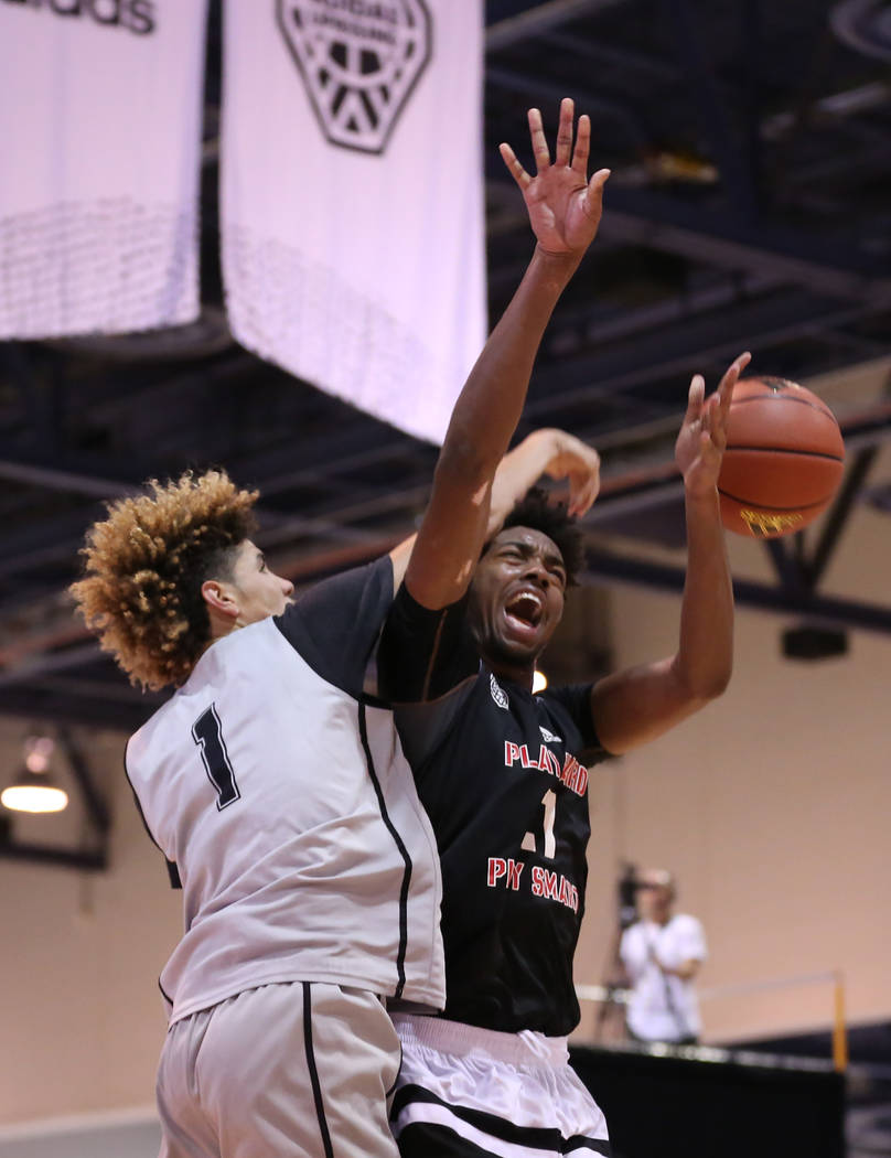 Big Baller Brand player LaMelo Ball, left, knocks the ball away from Play Hard Play Smart pl ...