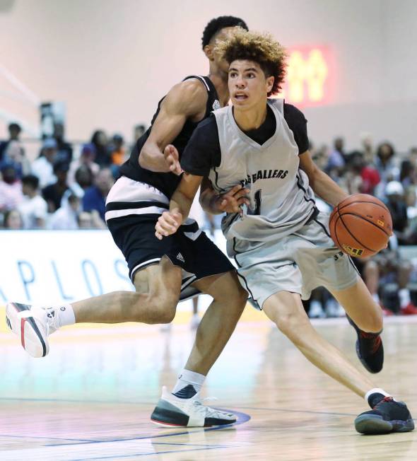 Big Baller Brand player LaMelo Ball tries to drive past a Play Hard Play Smart player during ...