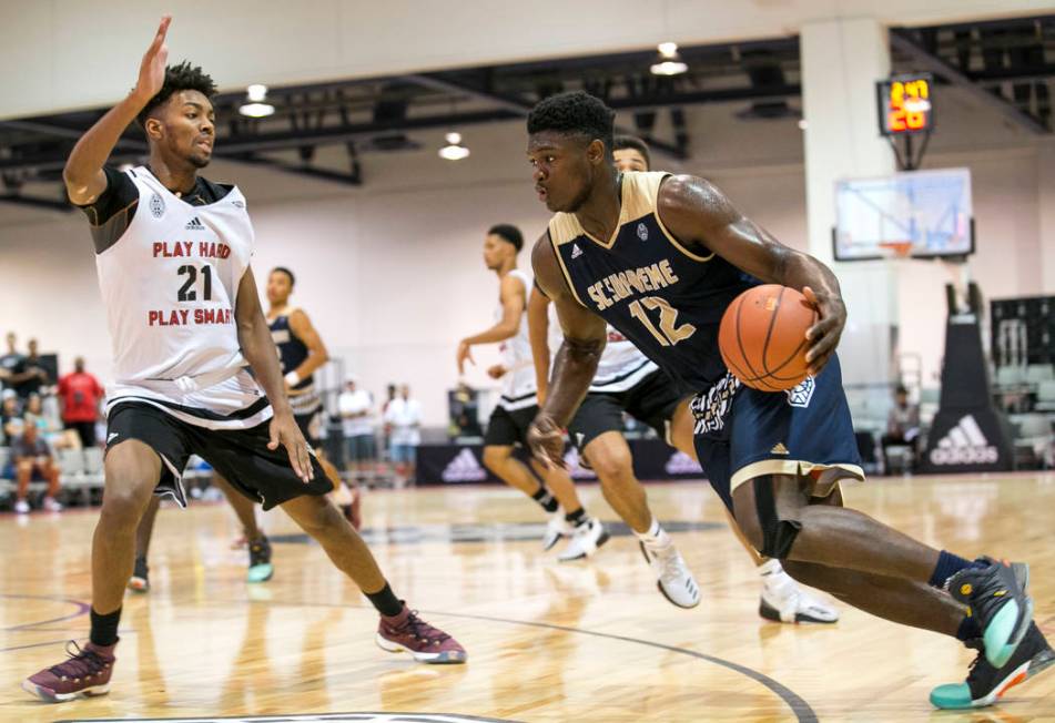 SC Supreme forward Zion Williamson (12) drives the ball under pressure from Play Hard Play S ...