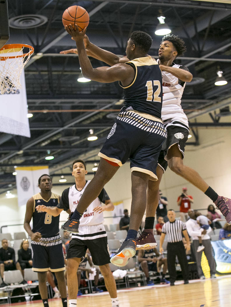 SC Supreme forward Zion Williamson (12) takes a shot over Play Hard Play Smart’s Jorda ...