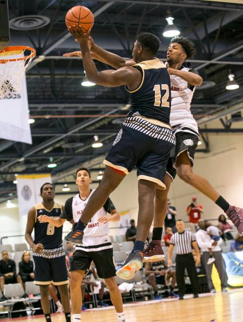 SC Supreme forward Zion Williamson (12) takes a shot over Play Hard Play Smart’s Jorda ...