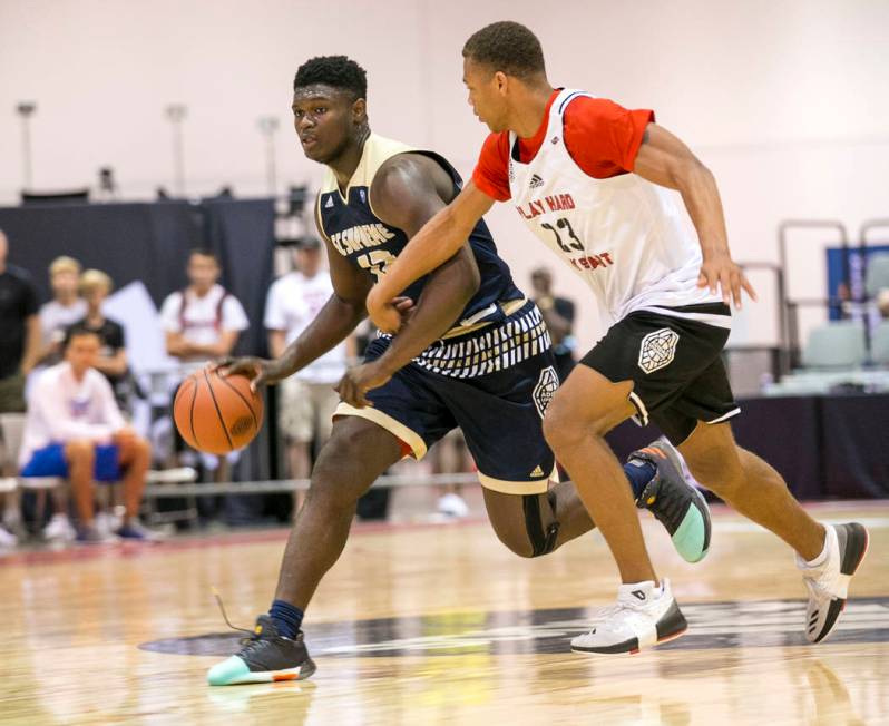 SC Supreme forward Zion Williamson (12) drives the ball by Play Hard Play Smart’s Chri ...