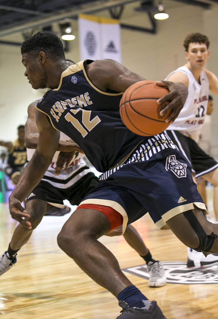 SC Supreme forward Zion Williamson (12) drives the ball under as he is pressured by Play Har ...