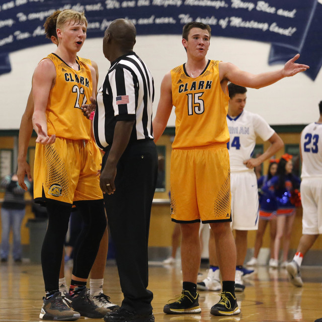 Clark’s Trey Woodbury (22) and Clark’s James Bridges (15) speaks with the refere ...