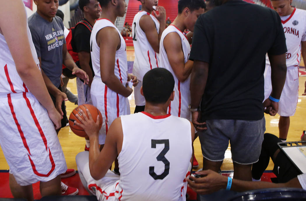 Liberty sophomore and California United player Julian Strawther (3) sit on the bench between ...