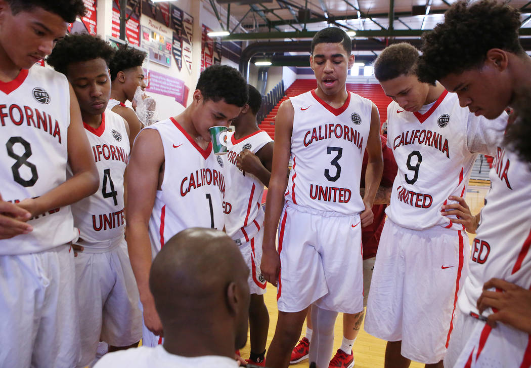 California United players gather around their coach and NBA player Quincy Pondexter during a ...