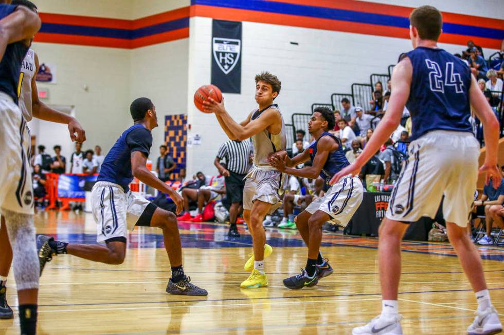 Team Thad’s Roman Ruio, center, looks to pass while warding off New York defenders dur ...