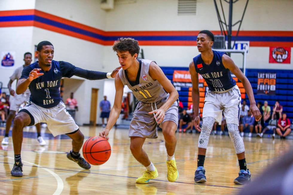 Team Thad’s Roman Rubio (11) drives toward the net against New York defenders Luther ...