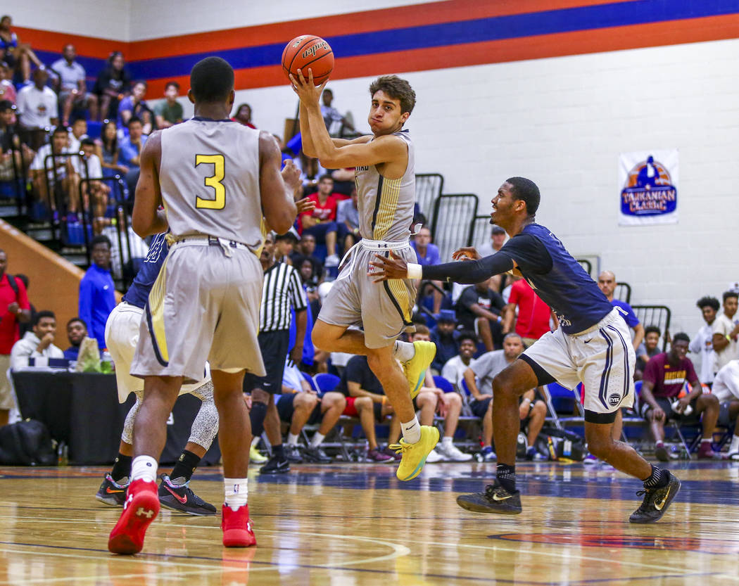 Team Thad’s Roman Rubio, center, looks for a pass while playing against New York durin ...