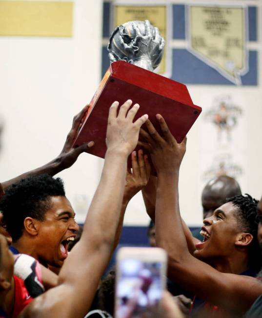 California Supreme Elite players hold their Platinum Elite Championship game trophy after wi ...