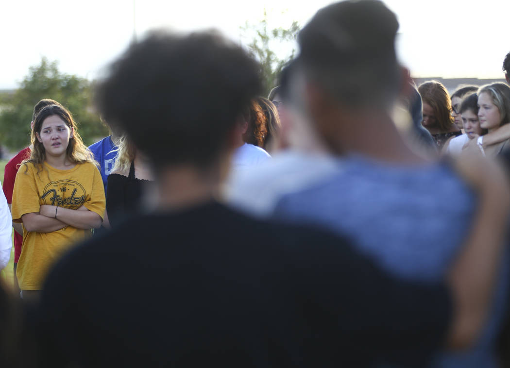 Savannah Day, left, speaks during a vigil for Haylei Hughes, a former Cimarron-Memorial stud ...