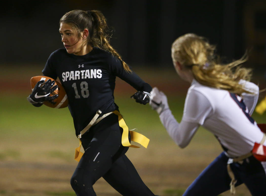 Cimarron-Memorial’s Haylei Hughes (18) runs the ball against Coronado during the Class ...