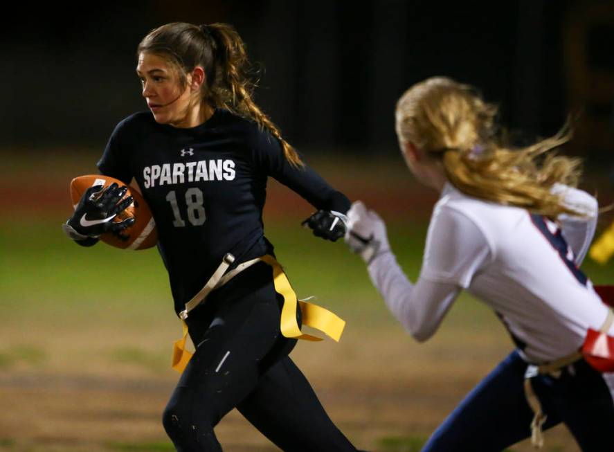 Cimarron-Memorial’s Haylei Hughes (18) runs the ball against Coronado during the Class ...