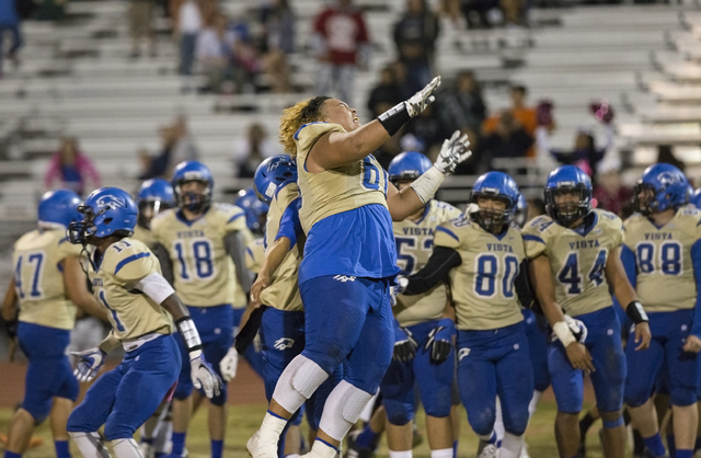 Sierra Vista’s Keki Faatiliga (60) celebrates with teammates after knocking off Durang ...