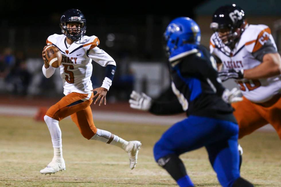 Legacy quarterback Roberto Valenzuela (5) looks for an open pass during a Sunset Region quar ...