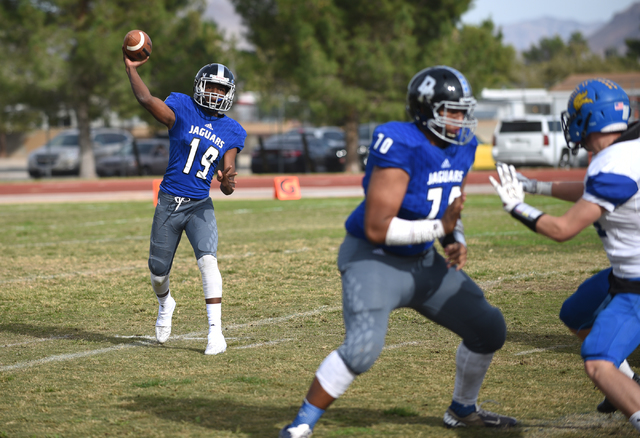 Desert Pines Tyler Williamson (19) throws the ball against South Tahoe during their 3A state ...