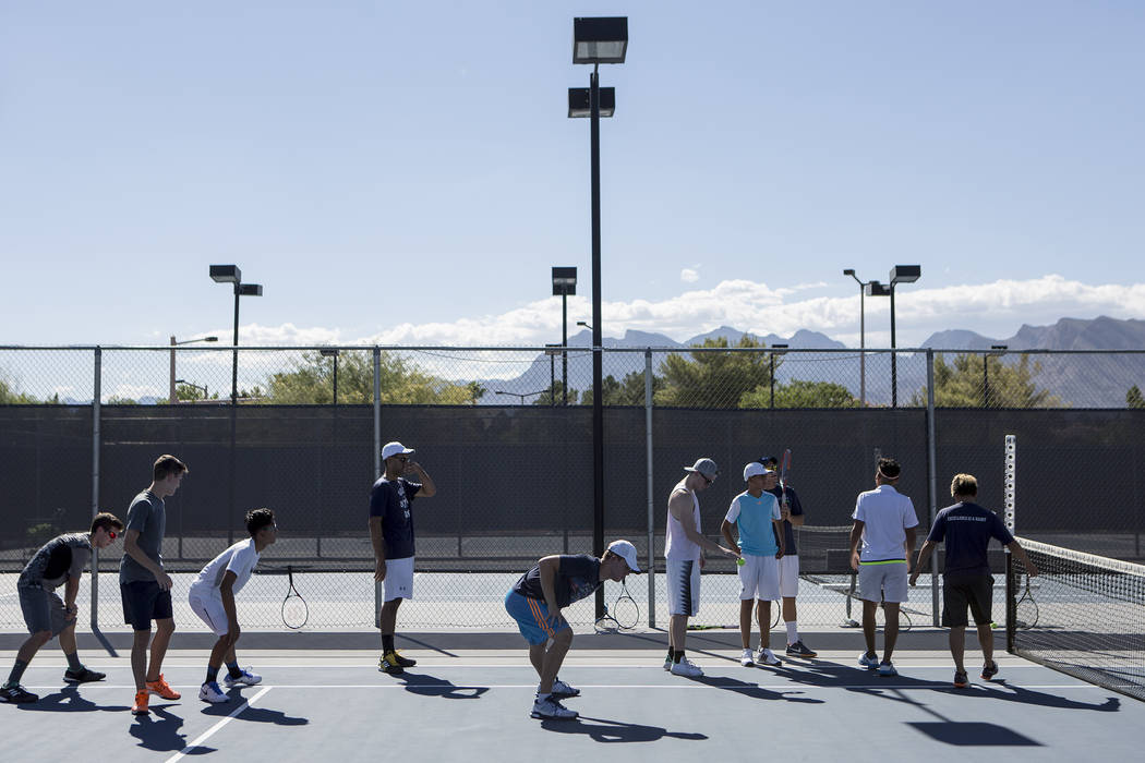 Meadows School tennis players warm upʤuring practice at the Meadows School on Thursday ...