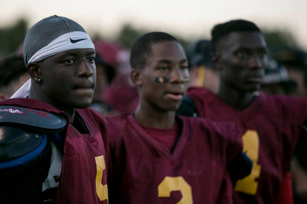 Del Sol senior Taariq Flowers, left, watches during a three-team scrimmage at Del Sol High S ...