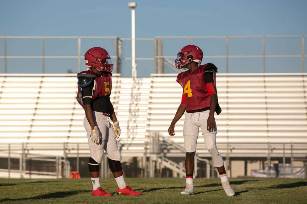 Del Sol senior Taariq Flowers, left, talks with his brother and sophomore teammate Maalik Fl ...