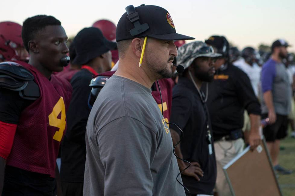 Del Sol head coach Mike Valenzuela watches during a three-team scrimmage at Del Sol High Sc ...