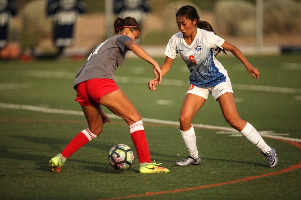 Arbor View High School’s Deja Erickson, 17, is guarded by Bishop Gorman’s Caitly ...