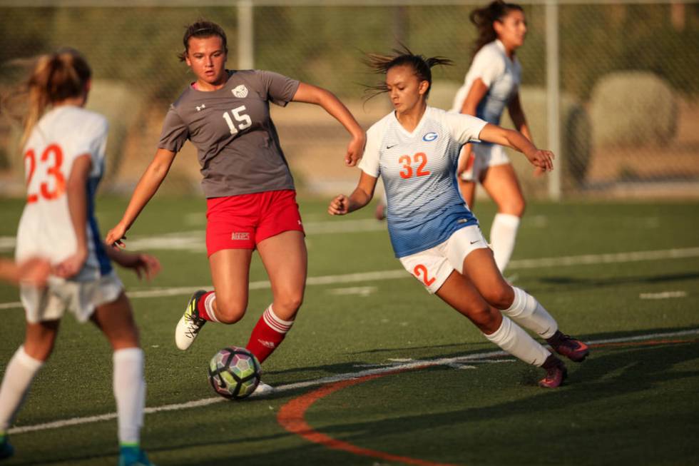 Arbor View High School’s Jolianna Meyers, 15, dribbles past Bishop Gorman’s Alex ...