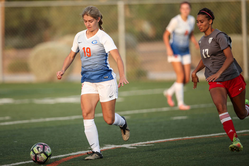 Bishop Gorman’s Teresa Richardson, 19, dribbles past Arbor View High School’s De ...