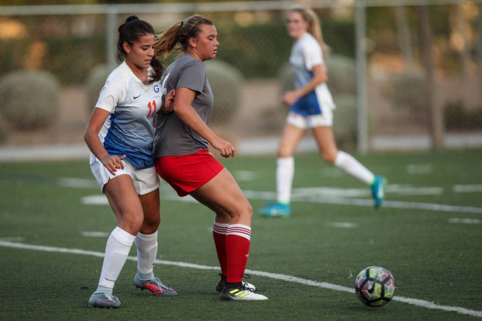 Bishop Gorman’s Jasmine Anaya, 11, is guarded by Arbor View High School’s Jolian ...