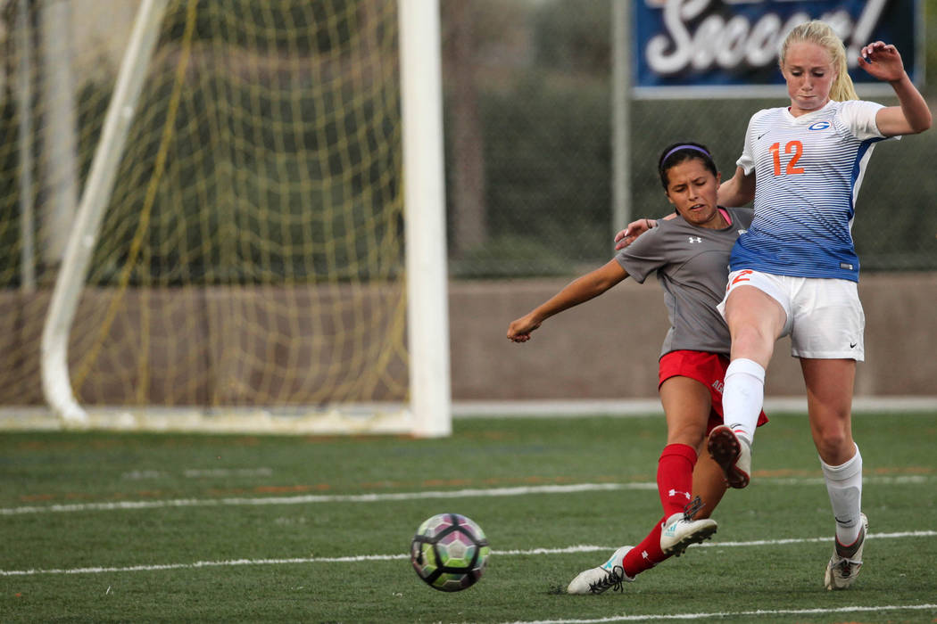 Arbor View High School’s Sierra Vicente, 1, and Bishop Gorman’s Kevyn Hillegas, ...